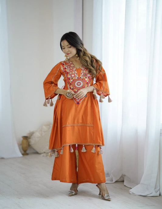 Orange Peplum Style Suit With Foil Mirror Work and tassels